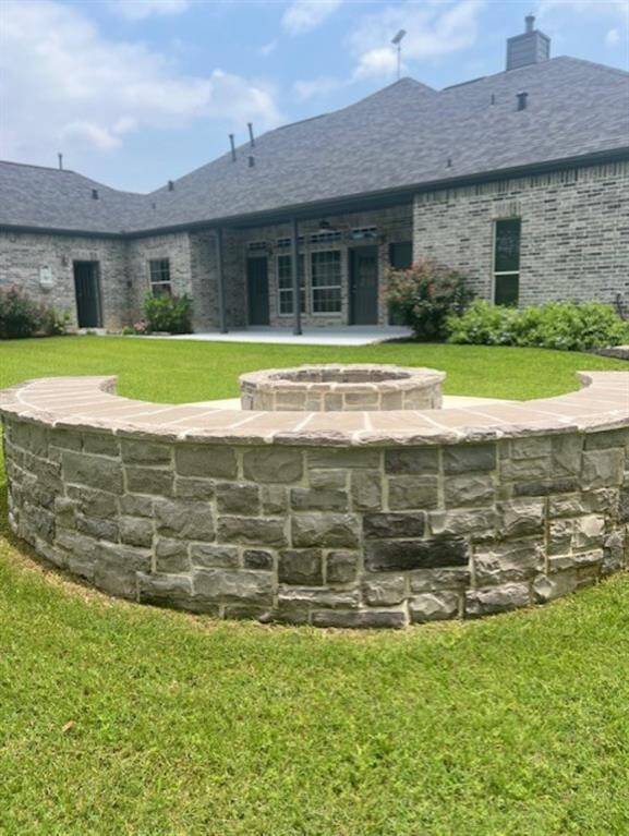 Great overhead view showing the privacy, the wonderful firepit area, and landscaping.  Notice the generator and the two a/c units!