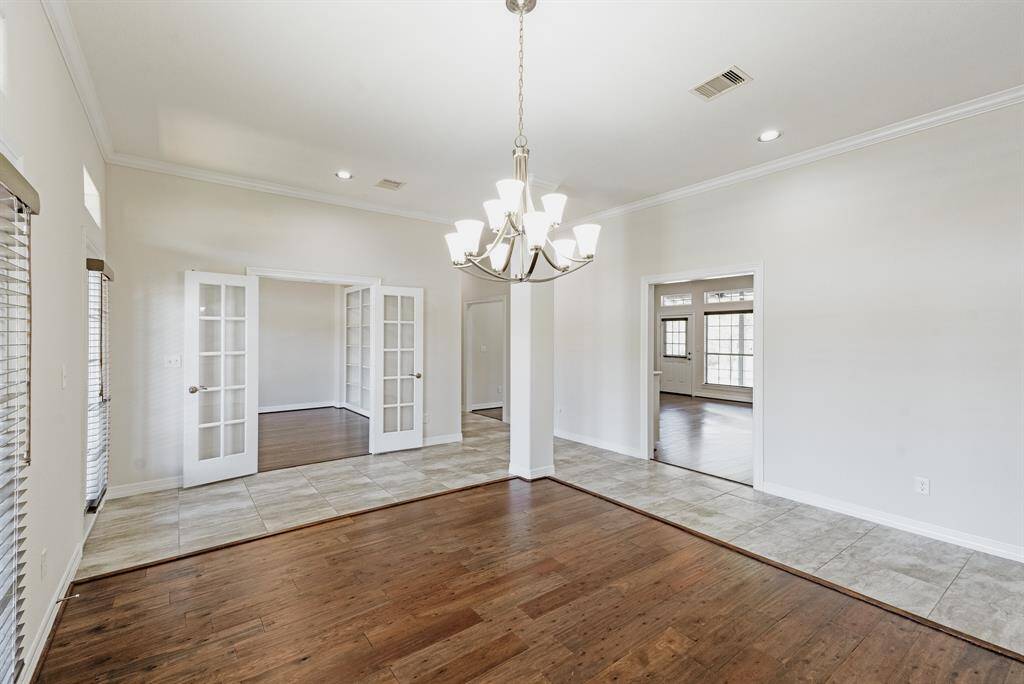 Open dining area with adjacent library/study flows to kitchen and living area.