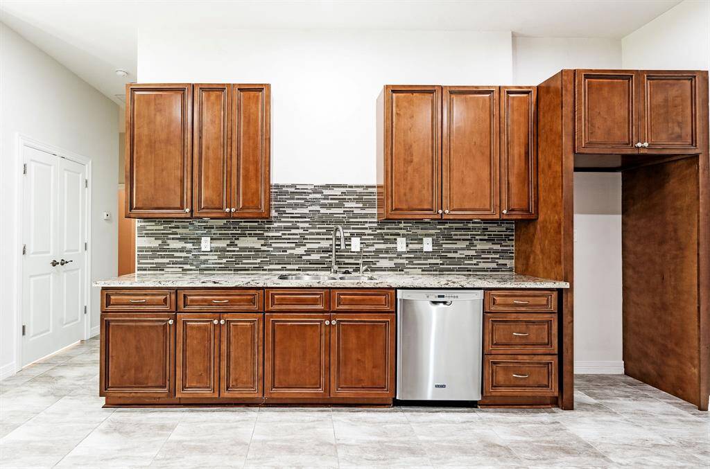 Kitchen area with large double door pantry located right off the kitchen area