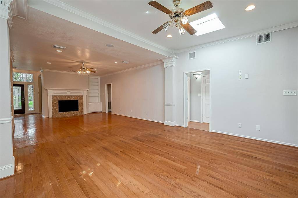 HUGE DEN with Wooden Floors & Skylights.