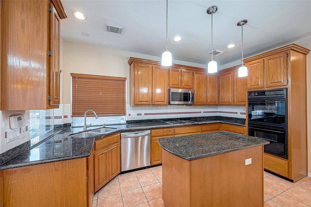 Kitchen with Granite Counters and Lots of CABINETS.