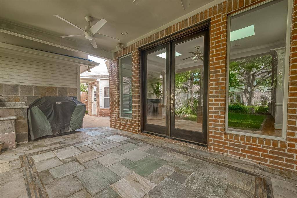 COVERED PATIO with Fan. Grill stays.