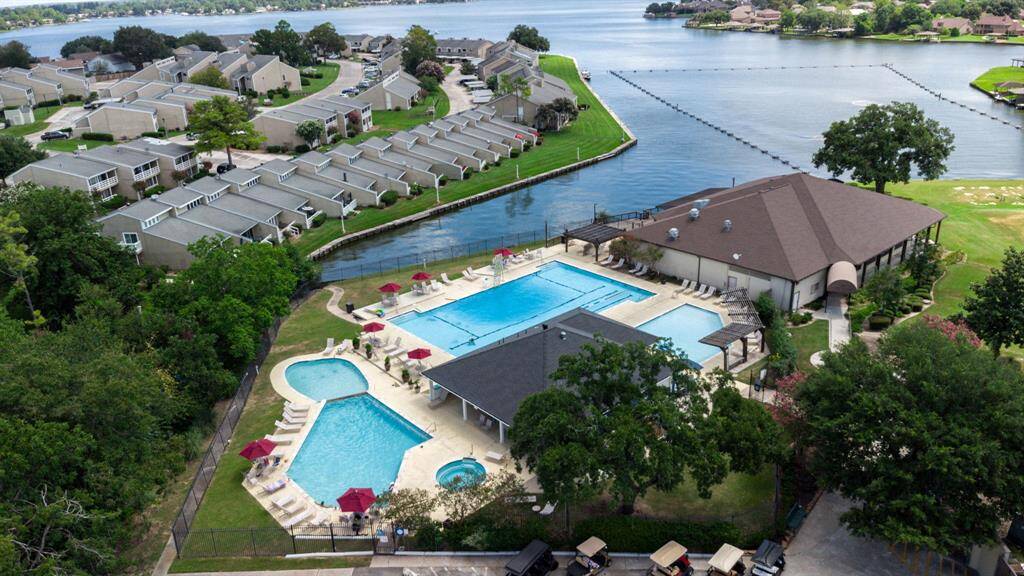 Experience luxury living at April Sound Country Club, featuring stunning lakeside views, elegant pools, and modern amenities. Perfect for relaxation and recreation in a serene community.