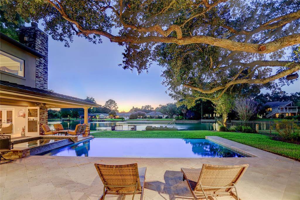 It's hard to believe this private lakefront retreat is minutes from the centers of Houston and Sugar Land.