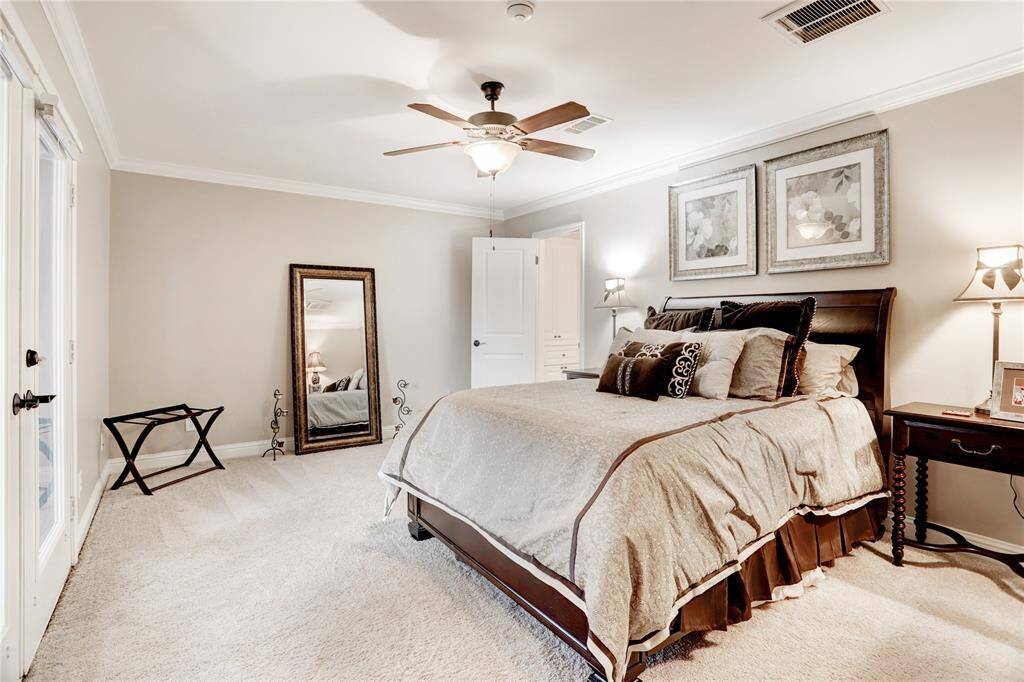 Second primary bedroom is nestled in it own wing of the first floor and has gorgeous lake views.