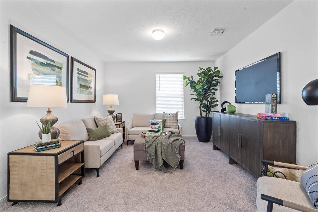 Come upstairs and enjoy a day of leisure in this fabulous loft! This is the perfect hangout spot or adult game room, this space features plush carpet, high ceiling, lighting, custom paint and a large window with privacy blinds.