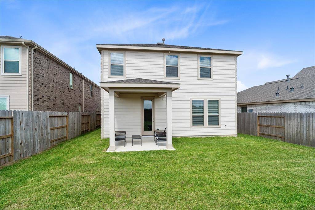 Come and see this spacious backyard with covered patio. There is plenty of room for the kids to play and adults to relax! Perfect for your outdoor living space, patio furniture, bbq pit, and so much more. The possibilities are endless!