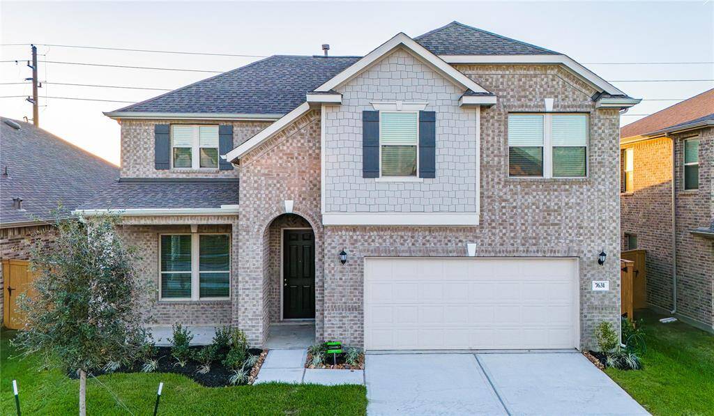 Secondary bedroom features plush carpet, custom paint and a large window with privacy blinds!