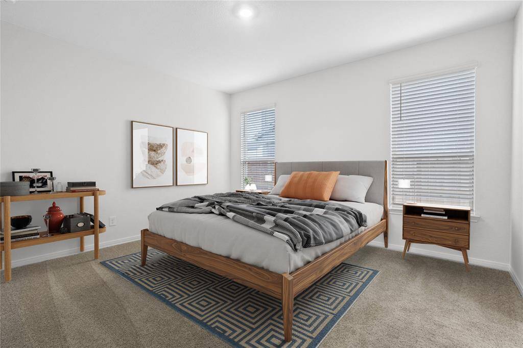 Come and unwind after a long day in this magnificent primary suite! This spacious room features plush carpet, warm paint, high ceilings and large windows with privacy blinds.
