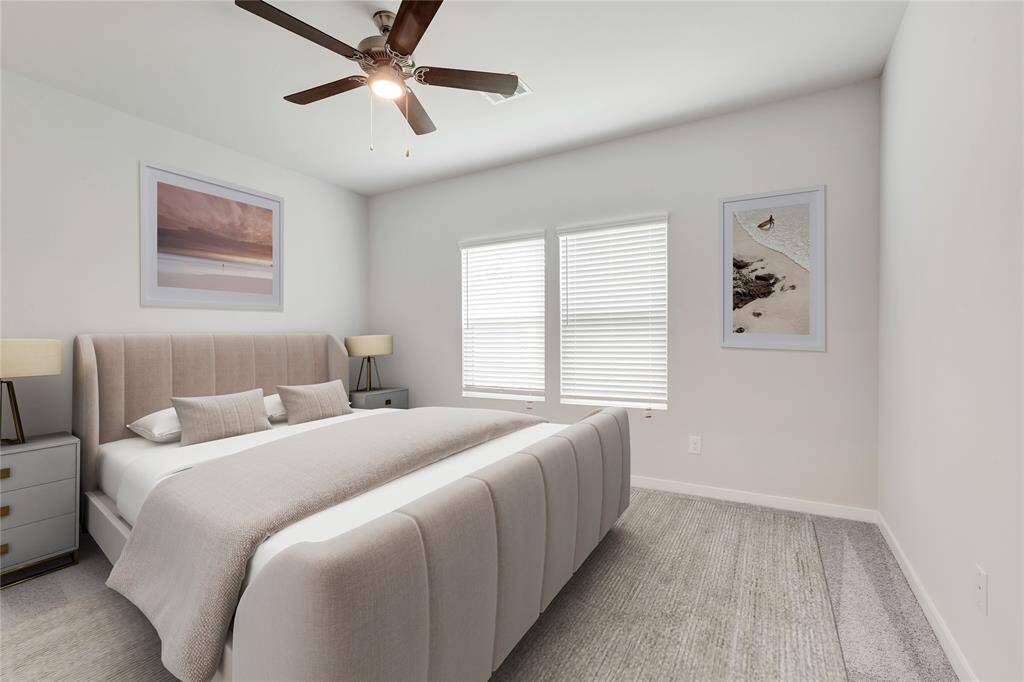 Primary Bedroom with natural light looking out the  patio