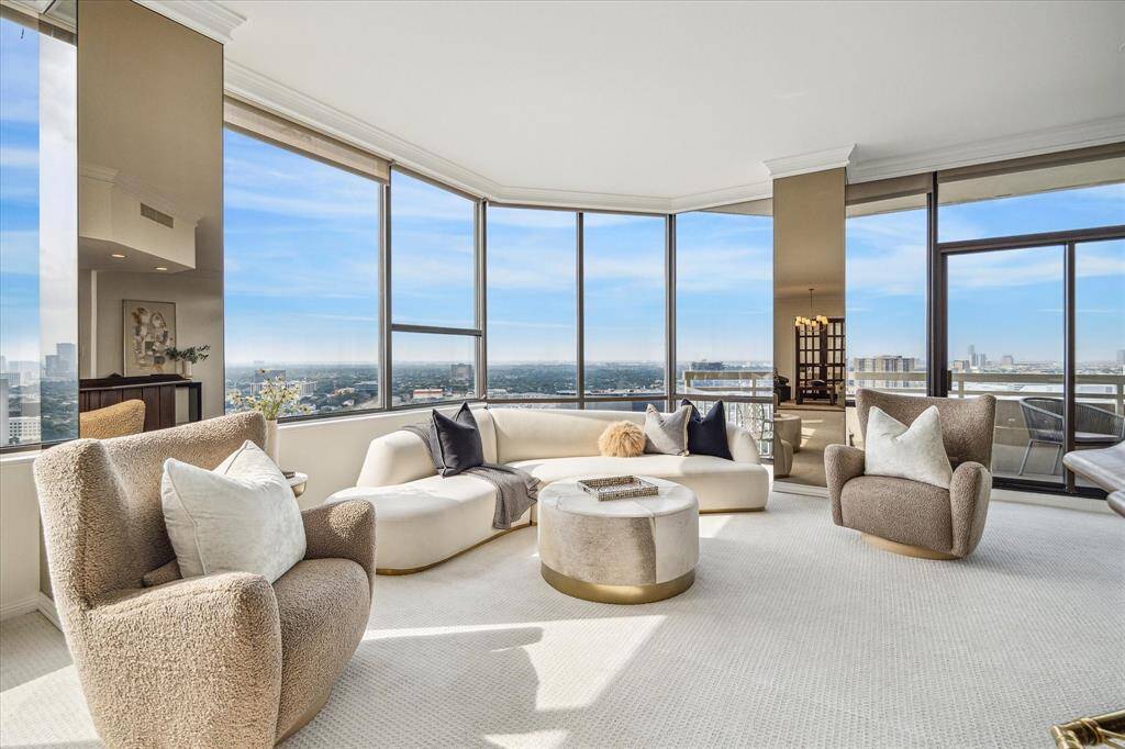 The epitome of penthouse living with window wall and endless views from living areas. Staging shown no longer in residence.