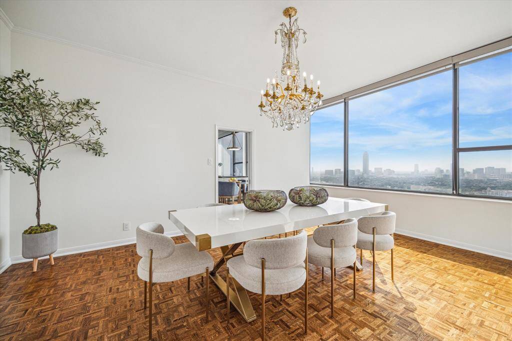 Preserved parquet flooring adds warmth and refinement in this formal setting. Staging shown no longer in residence.