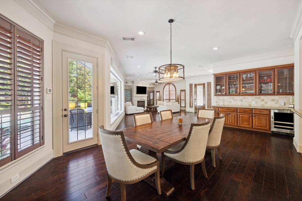 This perspective showcases the seamless flow of the space, with the dining area next to the butler's pantry and the living area.