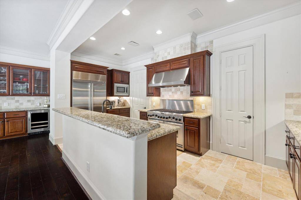 Engage in delightful conversations with your guests as they sit at the extended breakfast bar while you prep in the kitchen!