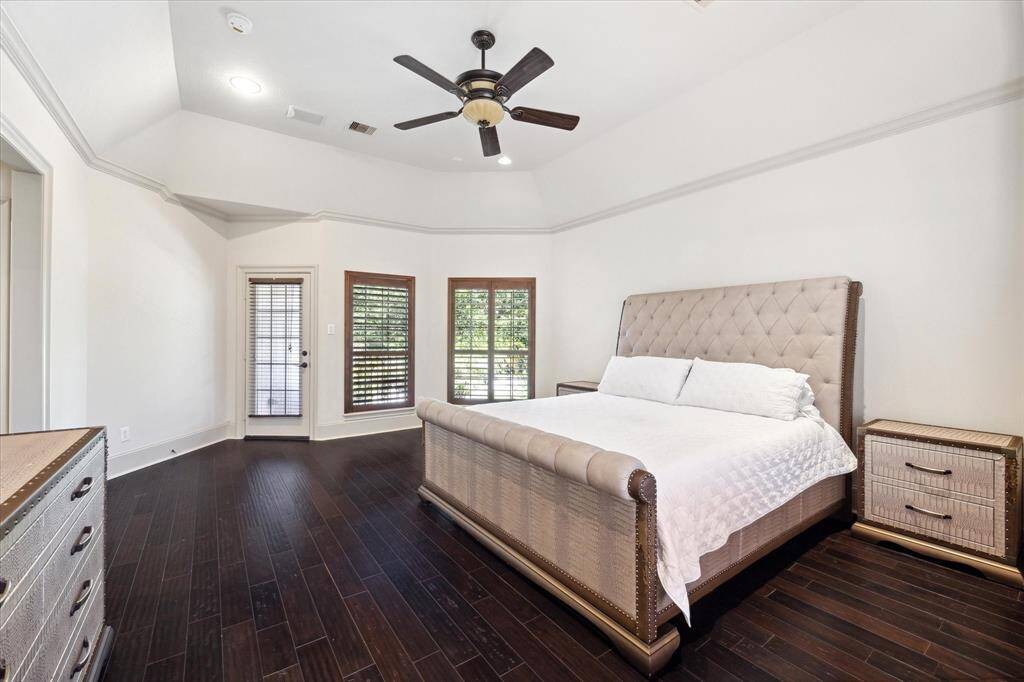 From this perspective, the glass door opens onto your private balcony, offering a stunning view of the beautiful backyard and pool.