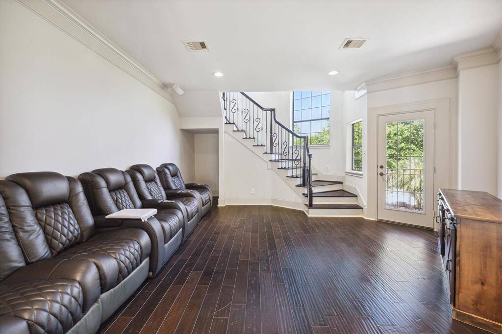 The second-floor den is awash with natural light from the impressive stairwell windows!