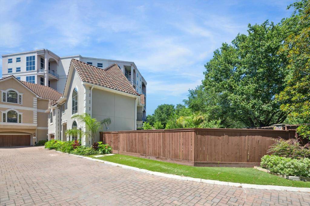 This property features a distinctive lot with a fenced backyard, complete with a pool, spa, and an outdoor kitchen!