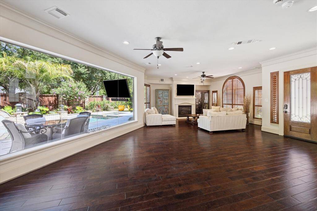 Take in the view from the large picture window in the living area, which beautifully showcases the backyard oasis.