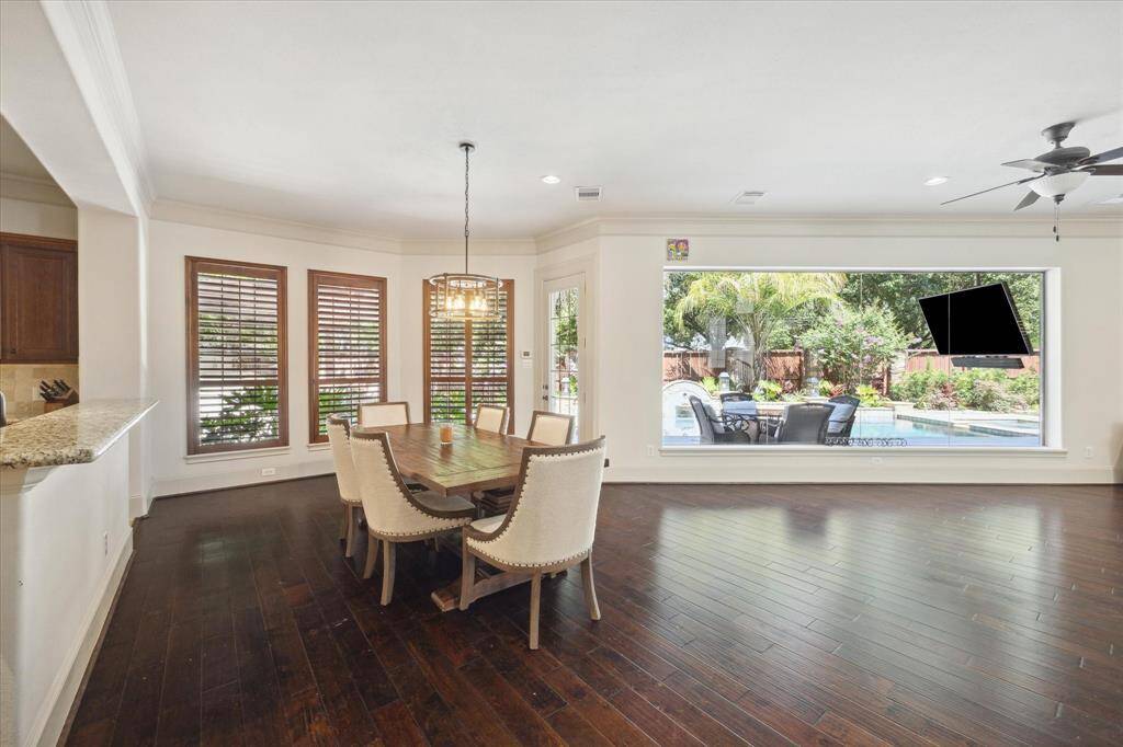 Savor the experience of indoor dining with the added pleasure of a stunning view of the backyard oasis.