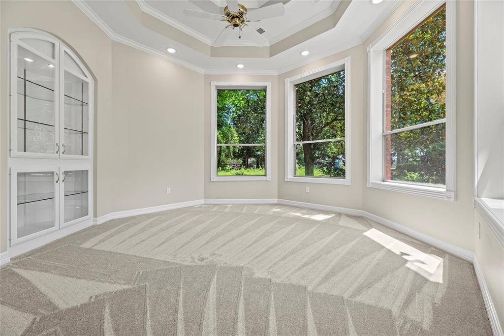 The flex room in the primary bedroom is the perfect space for a sitting area.