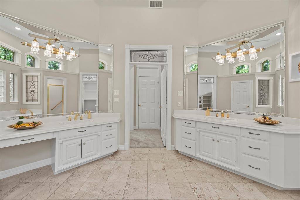 Dual vanities, one includes a makeup counter.