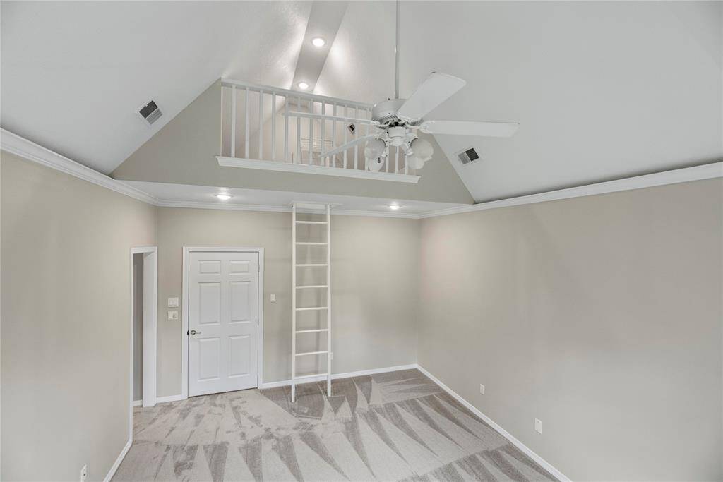 Upstairs bedroom features a unique loft area.