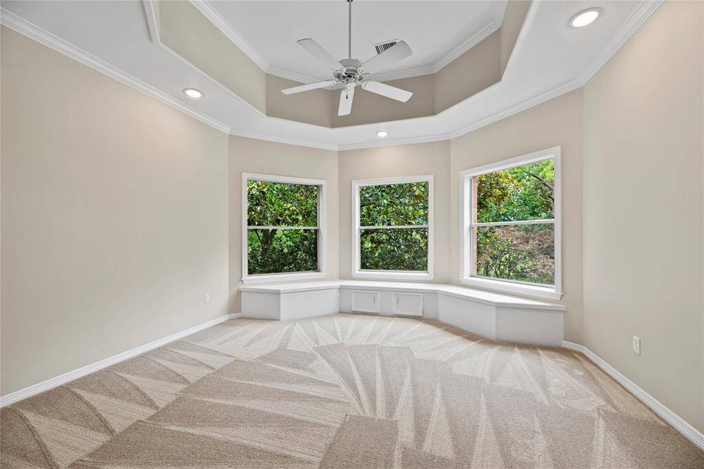 Upstairs bedroom with built-in storage.