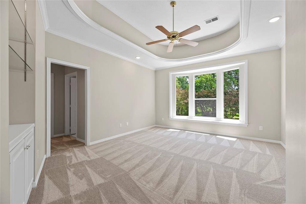 Upstairs bedroom with built-ins.