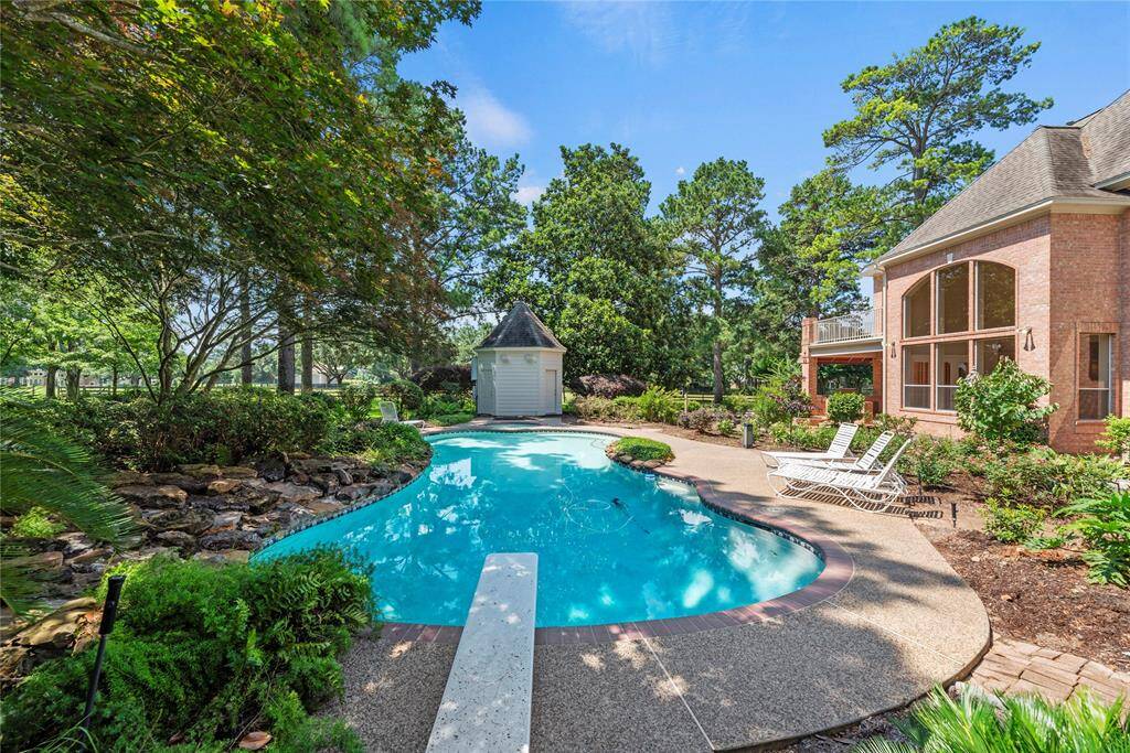 The pool house features a convenient half bathroom.