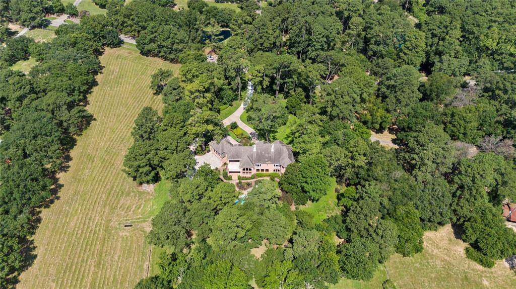 Aerial view showing the property including the pasture.