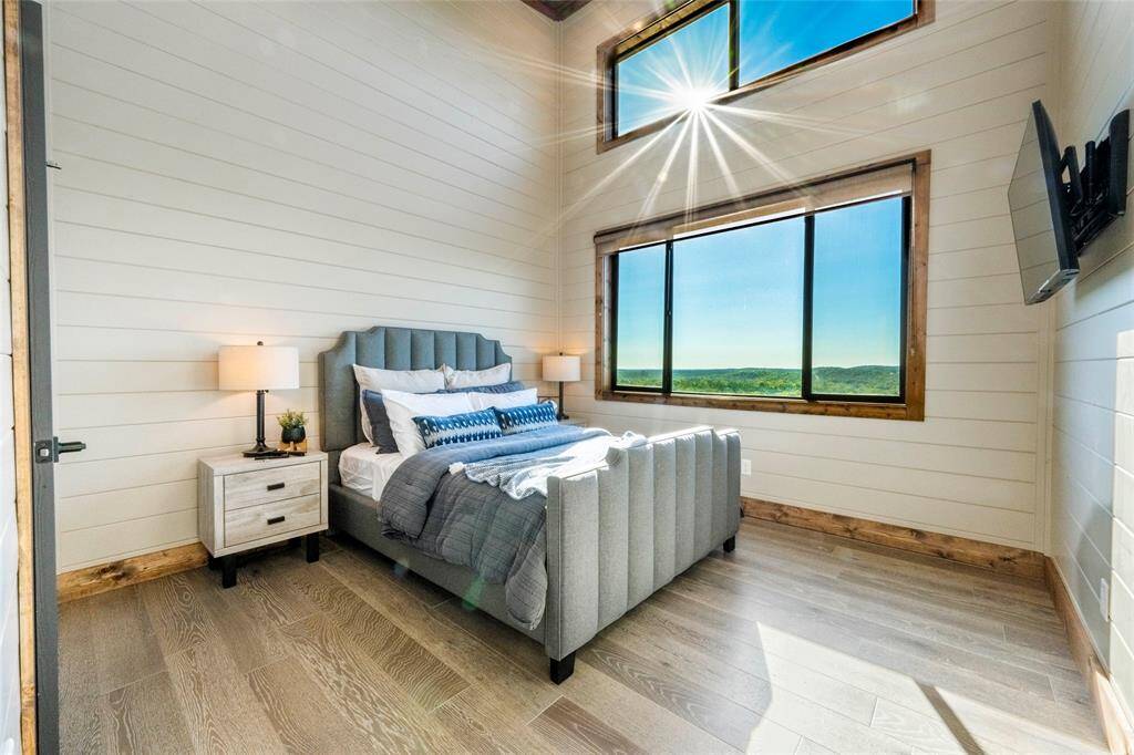 Adding an extra touch of elegance and comfort, this mountain top retreat features a cozy queen bedroom