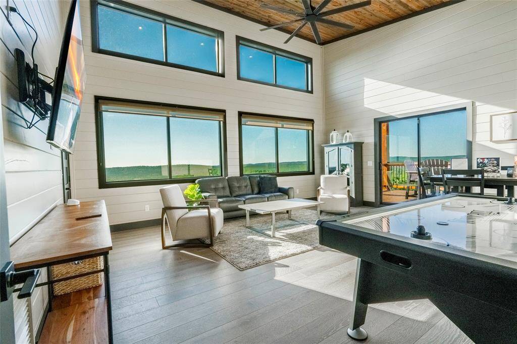 Entertainment meets elevation in the game room of this mountain top retreat, where fun and relaxation converge on the upper level