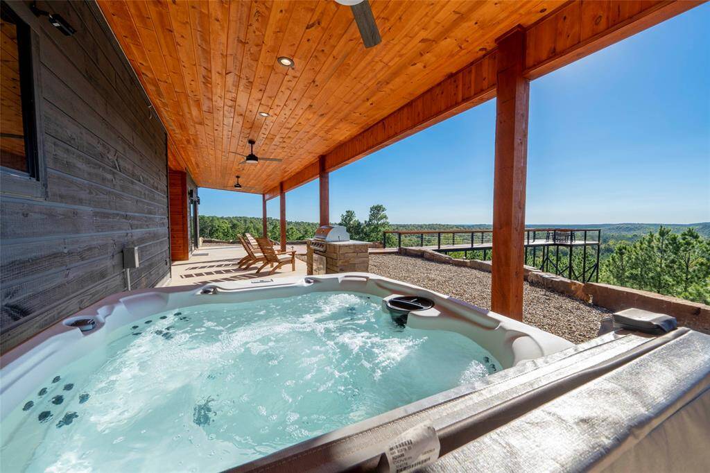 Indulge in the ultimate relaxation with a private hot tub at this mountain top retreat.