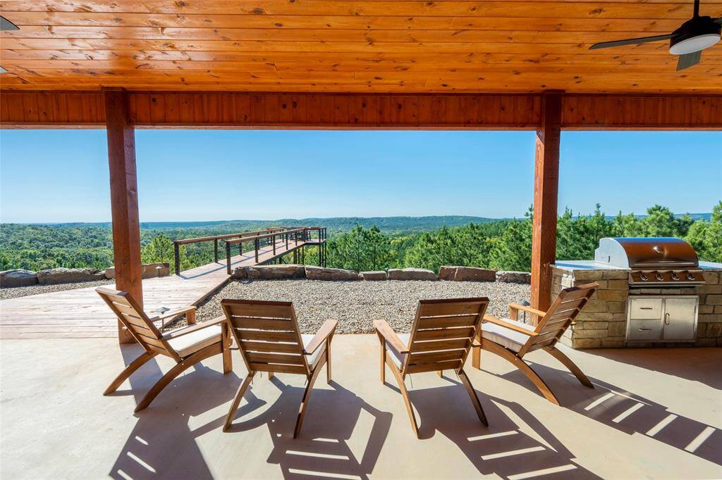 Comfortable and chic seating arrangements invite you to unwind, whether it's basking in the warmth of the sun, stargazing under the night sky, or simply savoring moments of tranquility on the front porch
