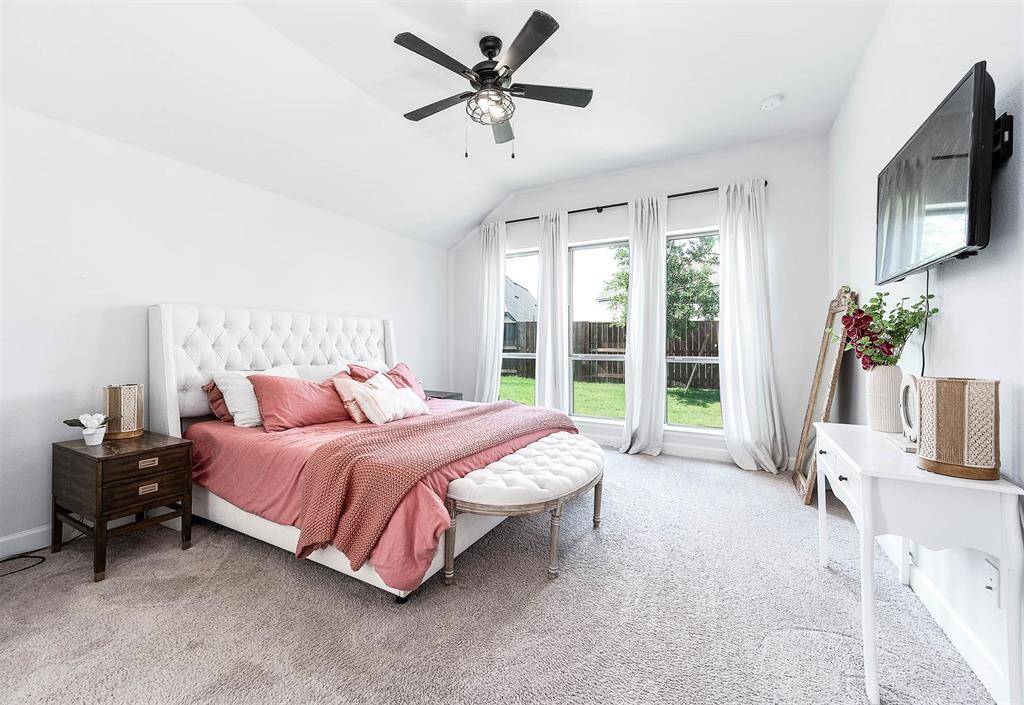 The generous-sized master bedroom boasts natural light galore from stunning windows that overlook the backyard, creating a bright and airy atmosphere. This private retreat is separate from the rest of the bedrooms, offering peaceful seclusion within the home.
