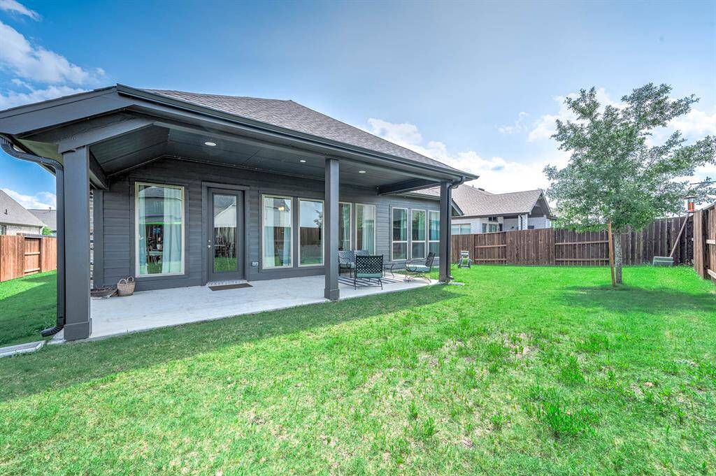 This beautiful home showcases these awesome windows (already prepped with pre-cutouts to place on windows for hurricane season) overlooking the backyard with plenty of covered patio space for family gatherings!