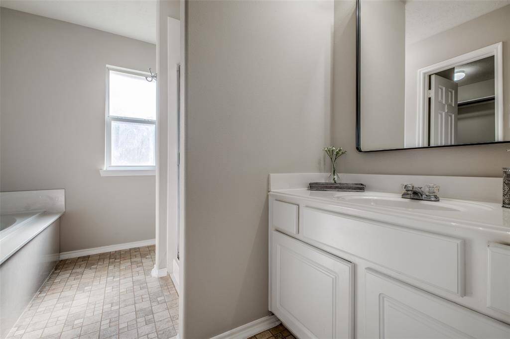 Primary sink with new mirror and hardware.