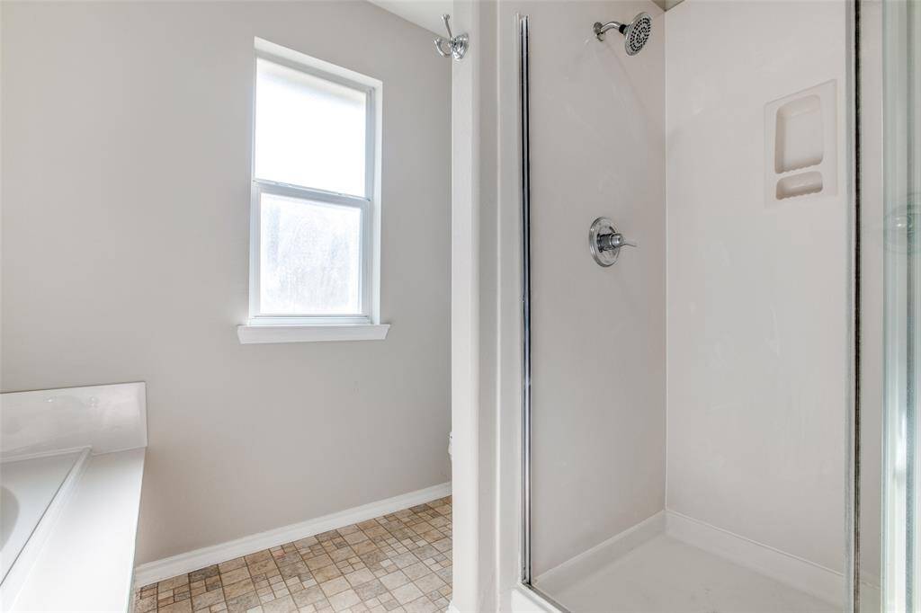 Stand up shower in the primary bathroom.