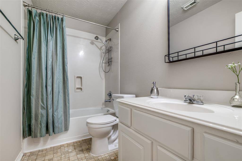 Guest bathroom with new mirror, new toilet and updated hardware.