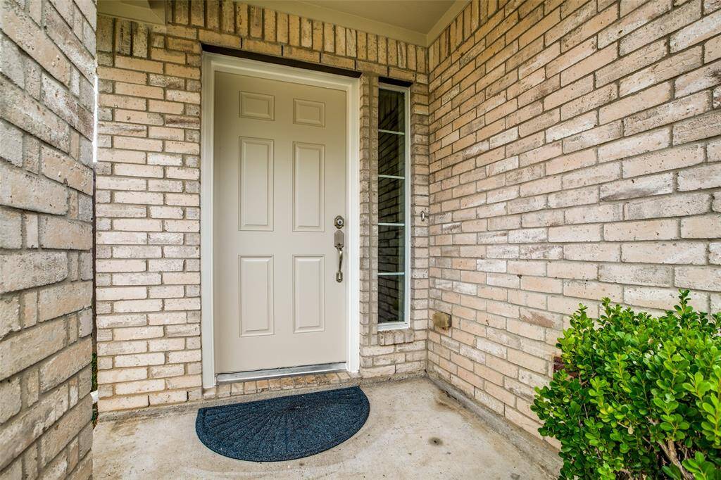 Freshly painted door, new hardware and new doorbell button.