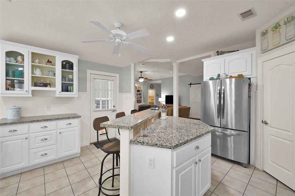 Chef's kitchen! Island, tons of storage, stainless steel and gas appliances