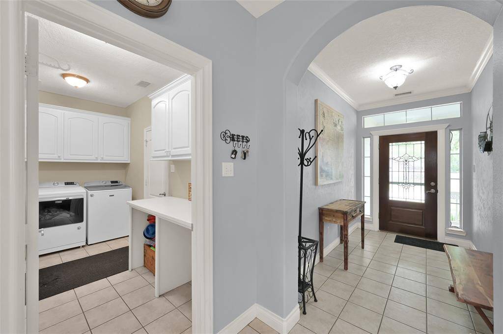 Utility room is spacious and has folding area