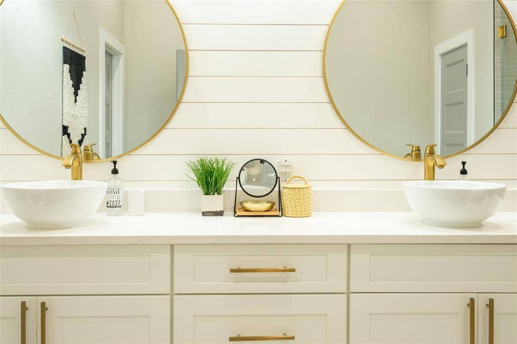 Dual vanities with attractive hardware.