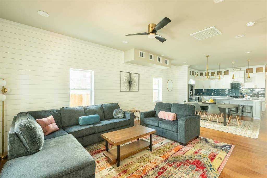 The spacious living room is open to the kitchen and dining area.