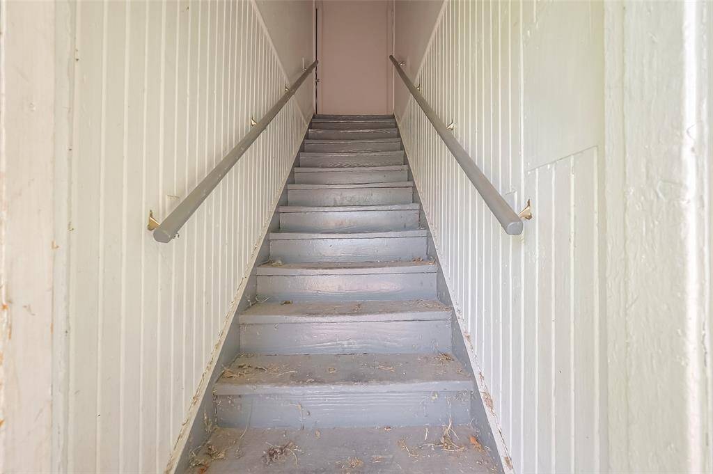 Stairs leading to the two upstairs units.