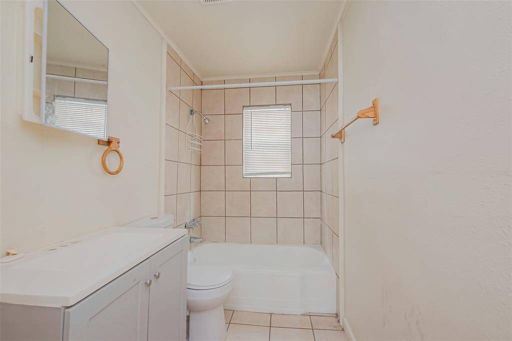Indulge in this beautifully designed bathroom that offers the perfect blend of functionality and comfort. Featuring a bath/shower combo.