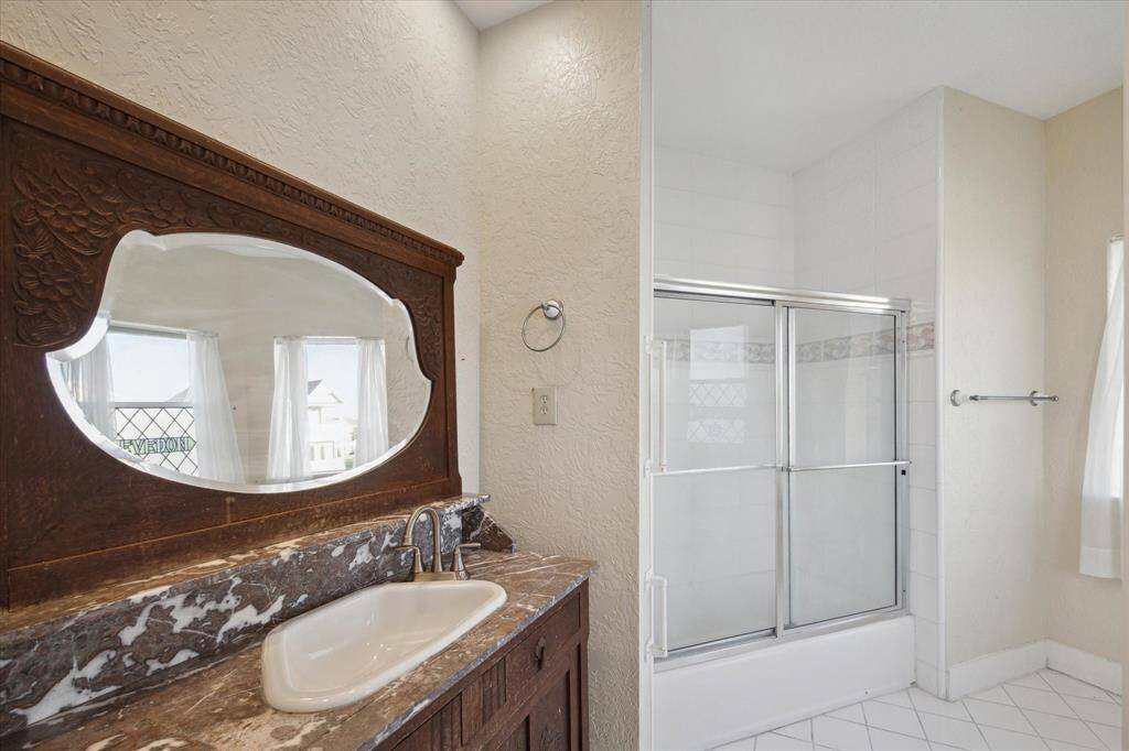 This is the private bathroom in one of the primary Bedrooms. It also has ocean views on the third floor.