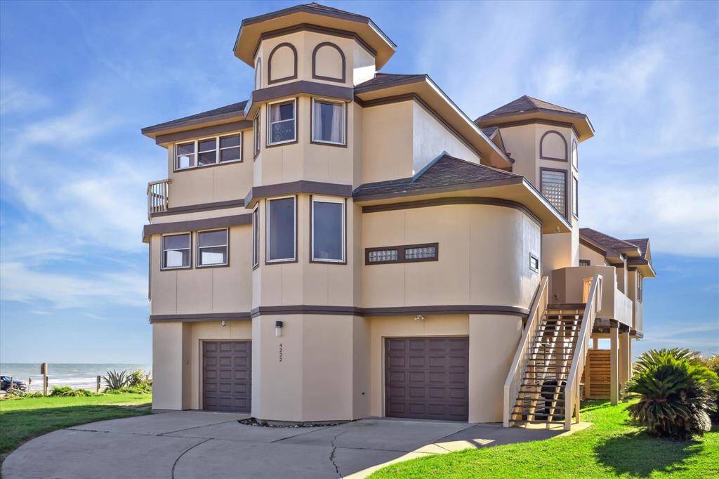 The renowned sandcastle beach house in the west end with balconies with stunning views.
