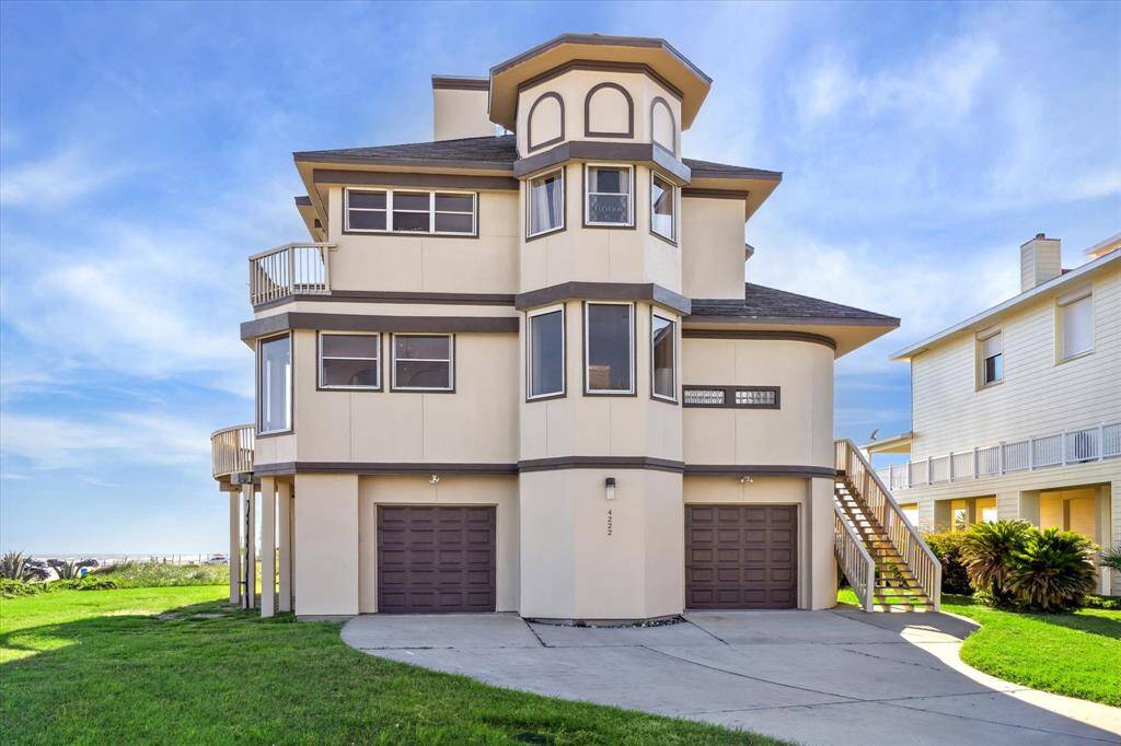 The renowned sandcastle beach house in the west end with balconies with stunning views.