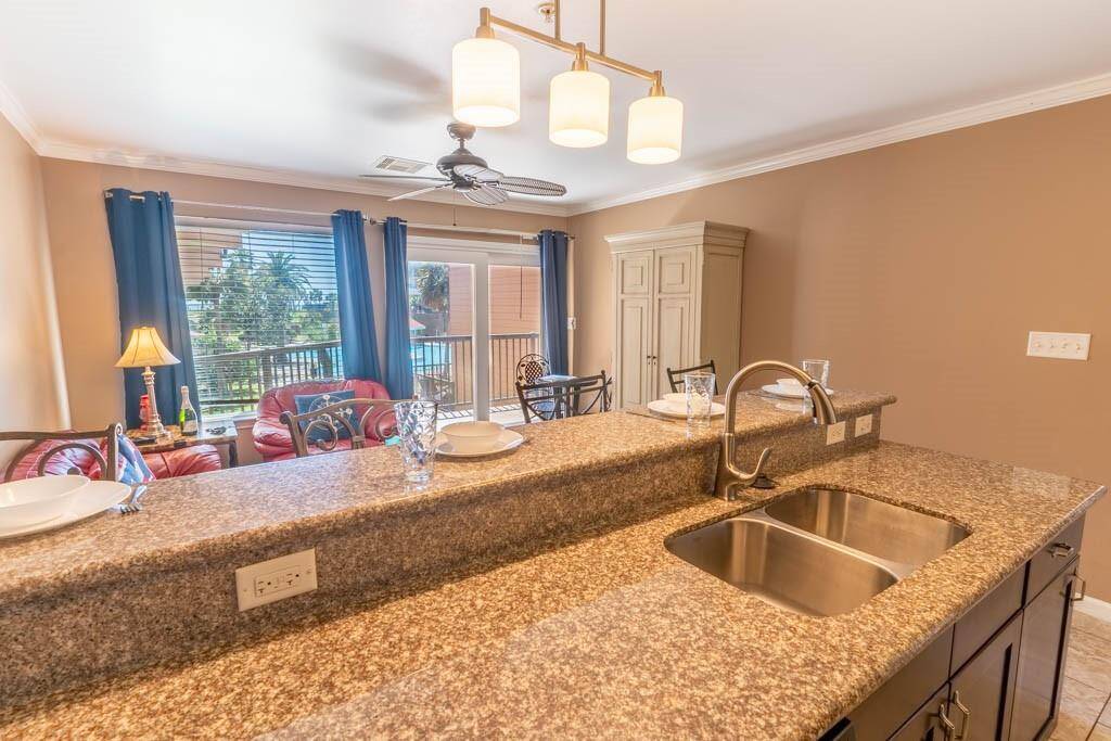 With sliding doors to the balcony that overlooks the largest of 3 pools and beyond